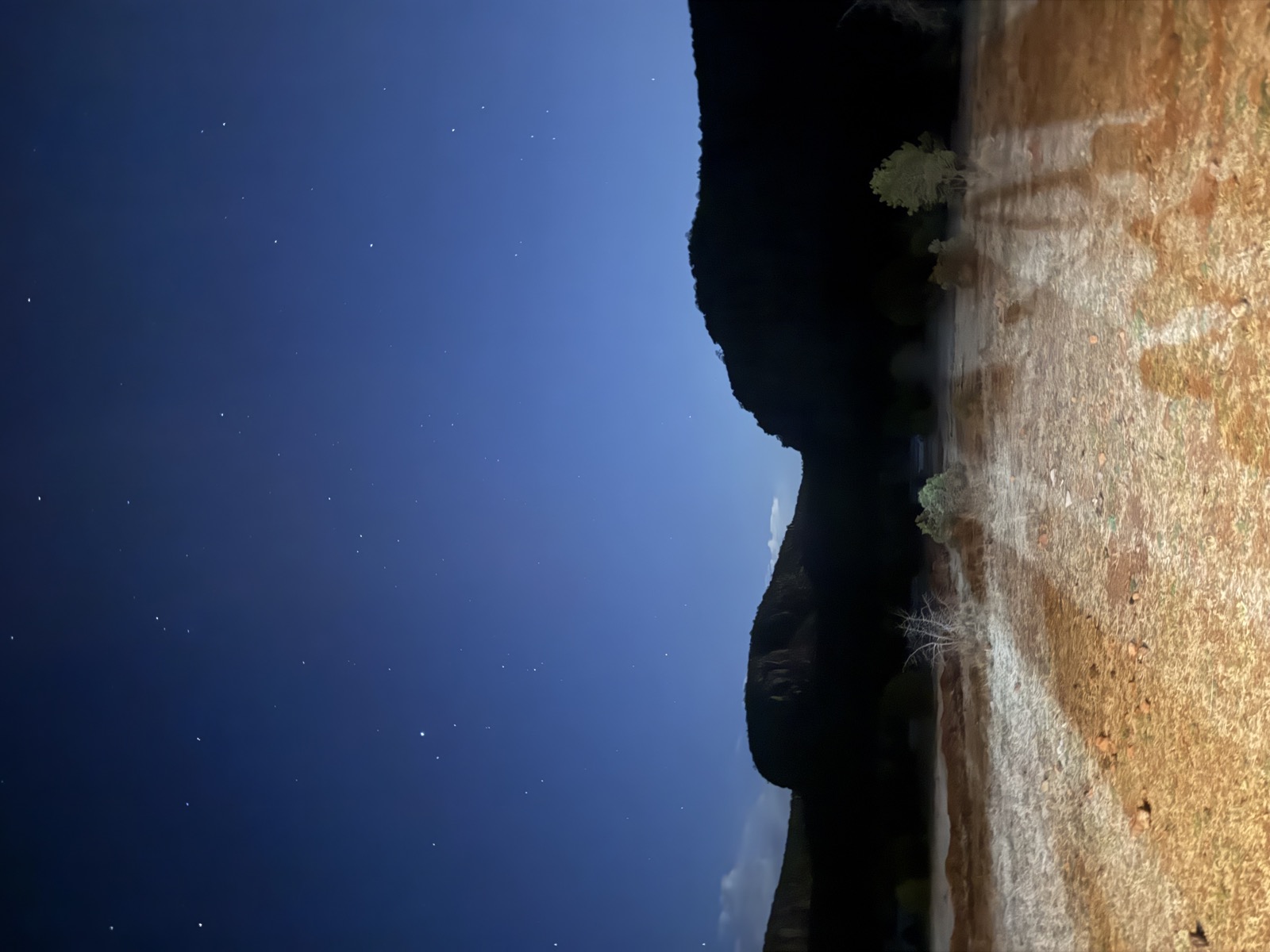 Stars and faraway clouds above the rim